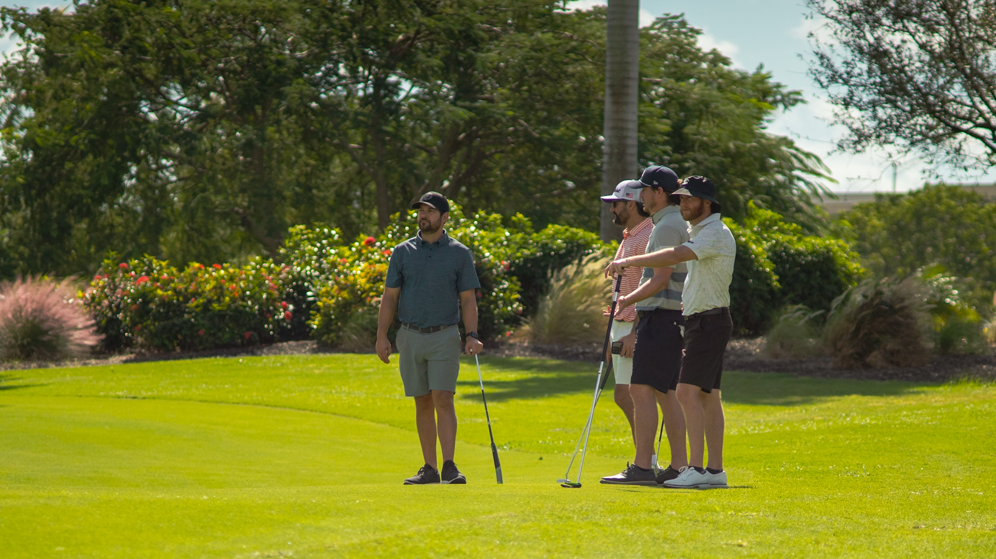 A foursome lined up on the green at the DFP Classic