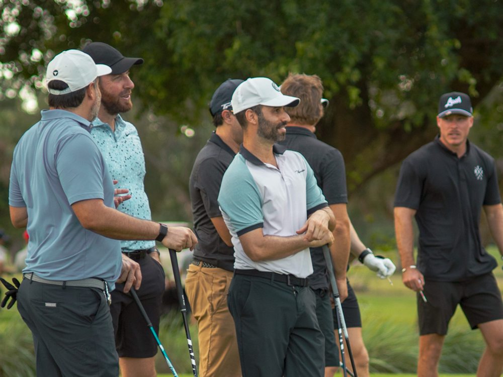 A team of golfers together at the tee during the DFP Classic